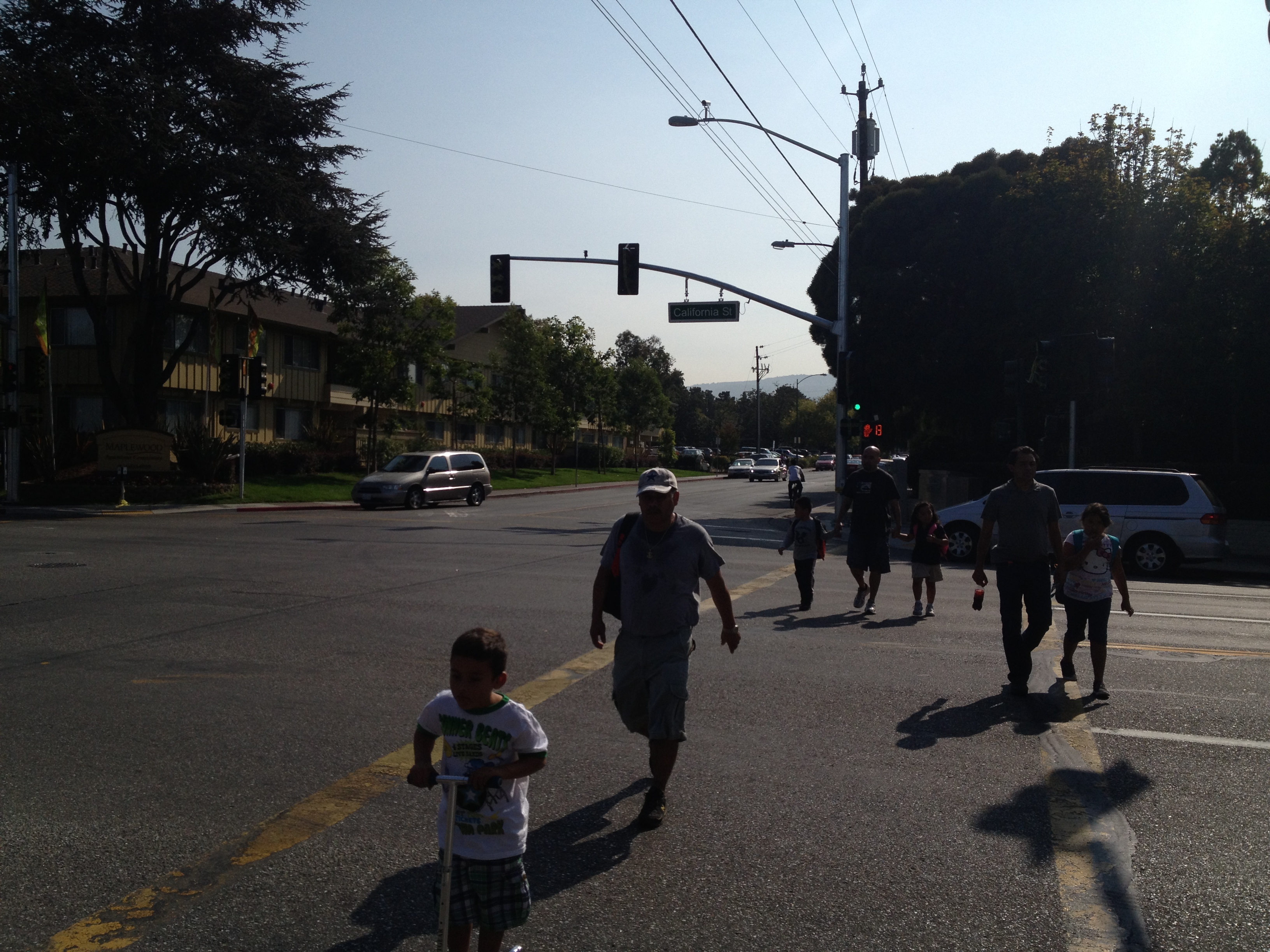 Pedestrians crossing California Street at Escuela Avenue