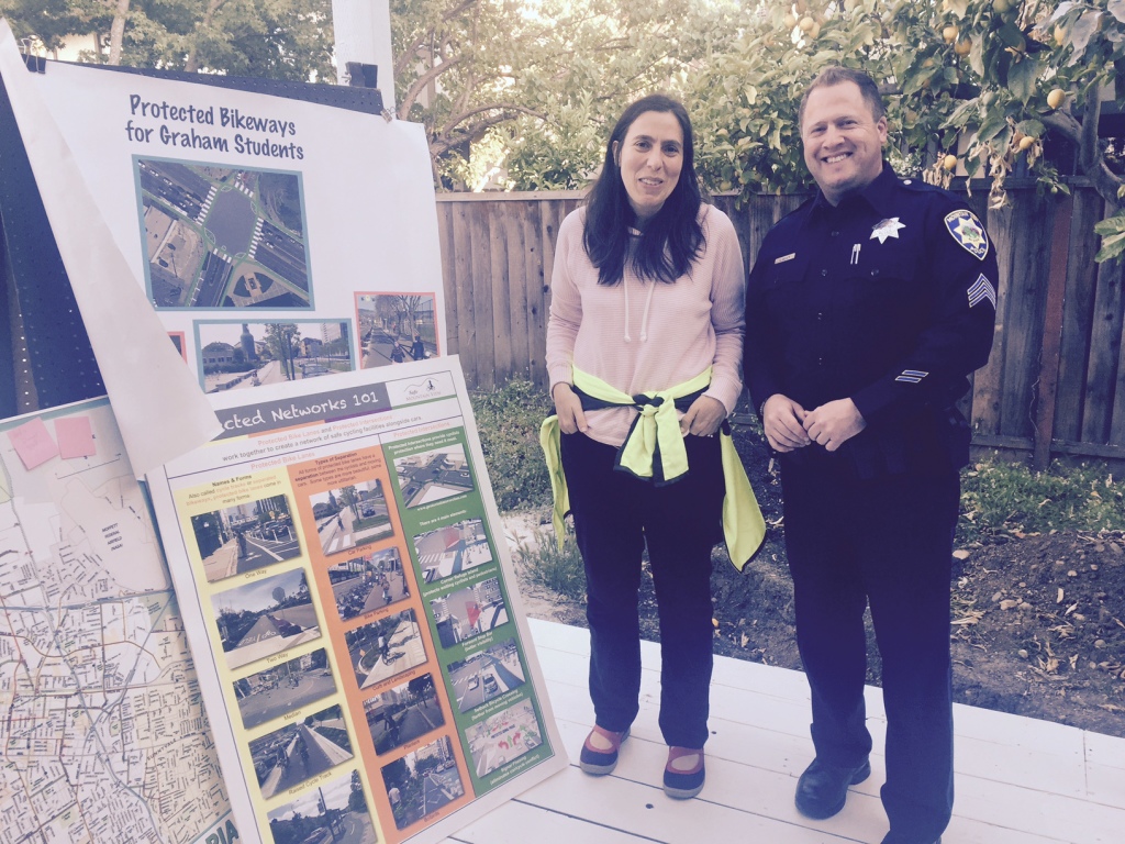 Jennifer talks to Sgt. Jaeger about reconfiguring lanes on Castro Street to improve safety for Graham Middle School students